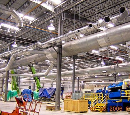 Industrial ventilation ductwork main with multiple branch lines, support steel and access doors