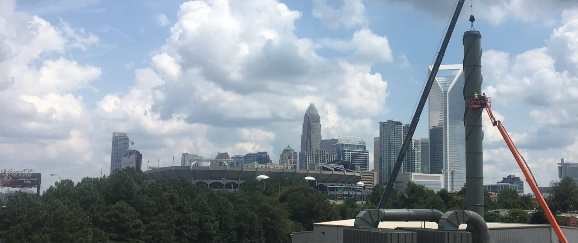 Installing a stack with Charlotte, NC, skyline in background